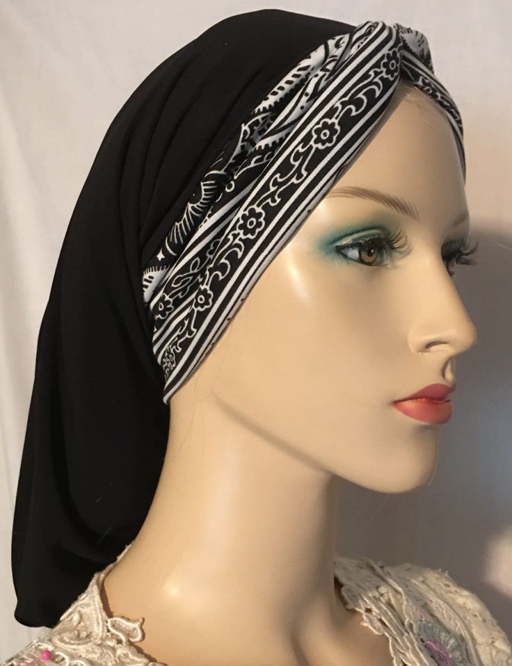 BLACK SNOOD with BLACK & WHITE DESIGN TURBAN BAND This elegant head covering combines a black snood with a front band featuring a captivating turban design in black and white. It is thoughtfully crafted for individuals seeking stylish and modest head coverings, as well as for women going through hair loss. Whether you're in need of a comfortable and fashionable addition to your wardrobe for everyday or special occasions, require a religious or modest attire, or need it for medical reasons such as thinning hair or hair loss due to cancer or chemotherapy, this snood is the perfect choice. This snood is designed for easy and comfortable wear, allowing you to effortlessly put it on and take it off. Crafted from a lightweight and premium blend of polyester and lycra, it ensures a soft and comfo Black Bohemian Headwrap For The Beach, Adjustable Black Casual Headwrap, Black Bandana For Beach, Adjustable Black Casual Headscarf, Casual Adjustable Black Headscarf, Adjustable Black Bohemian Headwrap, Black Headscarf In Headband Shape, Black Bohemian Headwrap In Headband Style, Black Bohemian Headwrap Headband