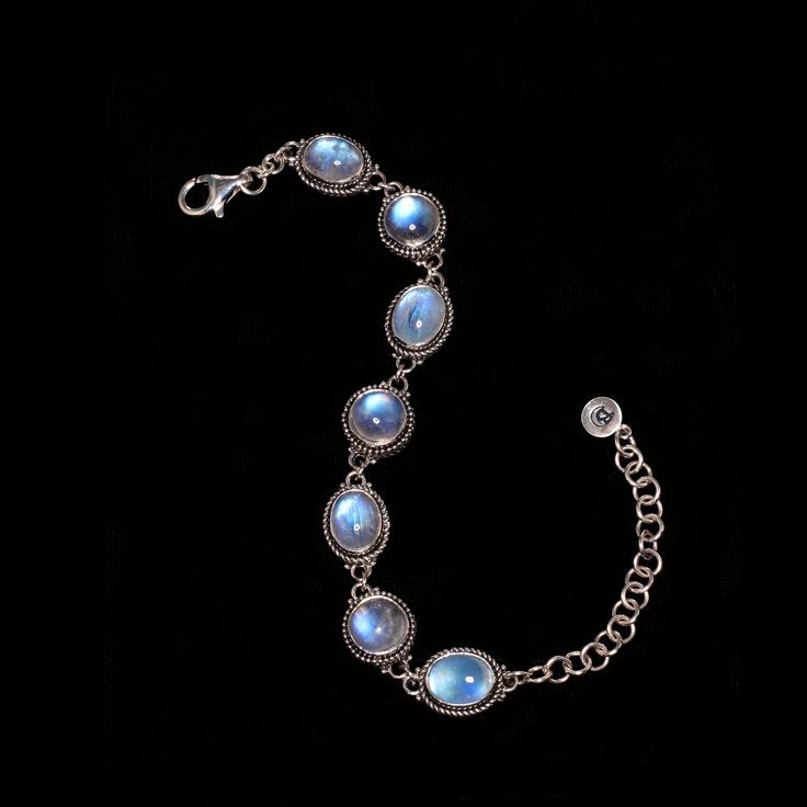 Sterling Silver Rainbow Moonstone bracelet, delicately designed & enhanced with opulent Moonstones, giving a sensual, feminine aura to this Elizabethan-inspired piece. Available in sizes 7 and 8. * Handcrafted in the finest .925 Sterling Silver. * Available in size 7:  6.5"-8" & size 8: 7"-9" * From my Mystic Moon Collection, featuring high-quality Rainbow Moonstones from India, fully-charged to enhance your intuition, provide protection & attract love. * Each natural gemstone is unique and may Luxury Moonstone Jewelry For Formal Occasions, Luxury Moon Shaped Jewelry For Formal Occasions, Mystical Gemstone Jewelry For Formal Occasions, Elegant Formal Moonstone Jewelry, Luxury Silver Bracelets With Cabochon, Elegant Silver Bracelets With Moon Phase, Elegant Oval Jewelry With Moon Phase, Elegant Moon Phase Bracelet As A Gift, Elegant Silver Moon Phase Bracelet