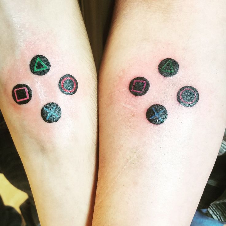 two people with matching tattoos on their legs