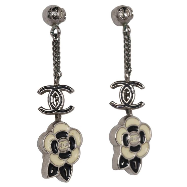 Authentic, pre-owned Chanel silver with black and white resin flowers and CC pierced earrings. You're going to love this pair of earrings! Very classic and pretty. Resin Flowers, Bag Packaging, Pierced Earrings, Earings Piercings, You Bag, Washer Necklace, Investment, Chanel, Bag Lady