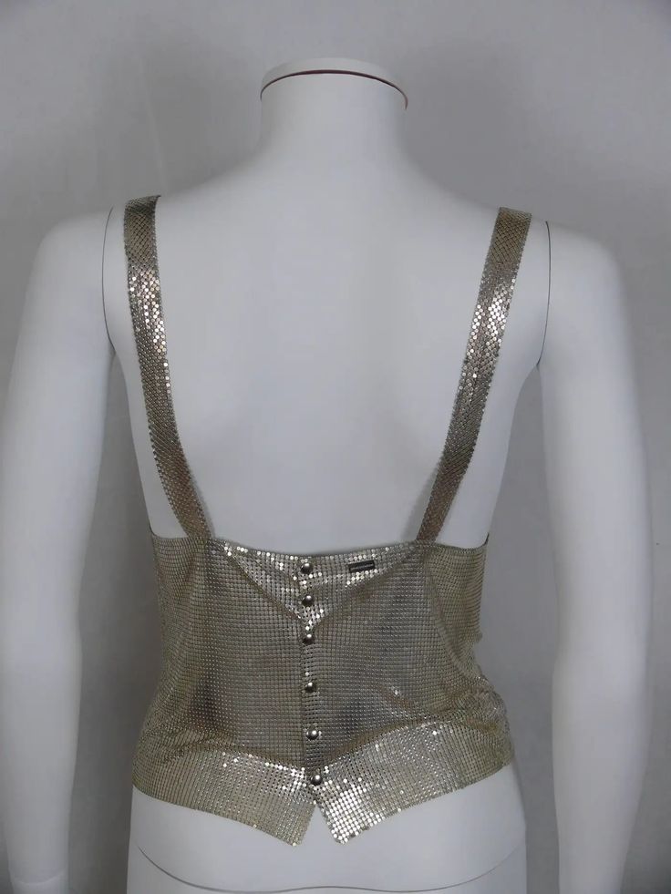 Paco Rabanne Silver Metal Mesh Tank Top For Sale at 1stDibs | silver tank top, metal mesh top, silver mesh top Glamorous Metallic Tank Top For Summer, Metallic Tank Top For Summer, Metallic Fitted Tank Top, Metallic Sleeveless Crop Top For Evening, Gold Sleeveless Top For Festival, Sleeveless Gold Top For Festival, Summer Party Mesh Tank Top, Glamorous Silver Tank Top For Party, Silver Sleeveless Crop Top For Evening