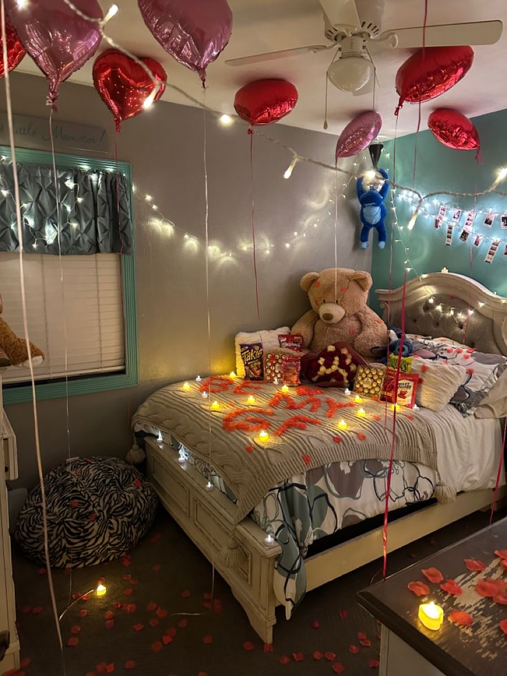 a bedroom decorated for valentine's day with balloons and teddy bears