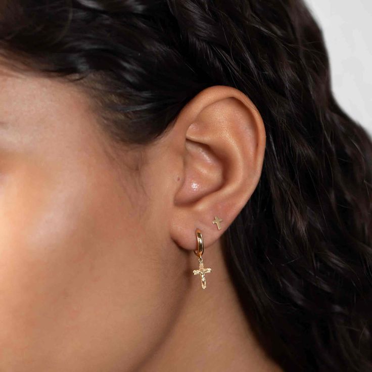 These small dangle 14K Gold Cross huggies earrings are a great addition to your ear stack. Set in 14K Gold, you'll never have to take them off!| Lead and Nickel free.Sold as a PAIR 14K Solid Gold Overall Height 22x6mm(0.8x0.25in) Hoop Inside Diameter 8.5mm(0.3in) Hinge closure #ES088-G 14k Gold Single Dangle Earring, Gold Plated Teardrop Huggie Earrings, Dainty Yellow Gold Dangle Piercings, Gold Plated Huggie Single Earring Piercing, Gold Plated Huggie Single Earring, Gold Plated Single Huggie Earring, Gold Dangle Huggie Earrings 14k Gold Filled, Fine Jewelry Tarnish Resistant Drop Cartilage Earrings, 14k Yellow Gold Filled Dangle Cartilage Earrings