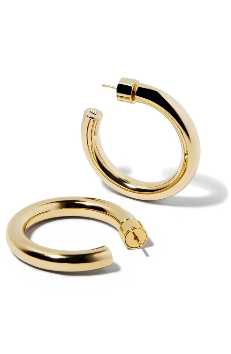 Refine everyday looks with the high-polish shine of these hoop earrings. 1" diameter; 1/4" width Post back 14k-gold plate Imported Modern Gold Hoop Earrings With Shiny Finish, Elegant Everyday Hoop Earrings With Gold-tone, Chic Polished Finish Hoop Earrings For Gift, Chic Polished Finish Hoop Earrings As Gift, Everyday Elegant Earrings With Gold-tone Hardware, Chic Polished Round Hoop Earrings, Chic Polished Hoop Earrings As Gift, Chic Polished Finish Round Hoop Earrings, Classic Hoop Jewelry With Gold-tone Hardware