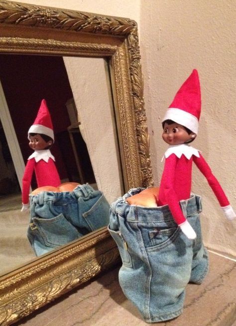 two elfs are standing in front of a mirror with their legs sticking out from the jeans