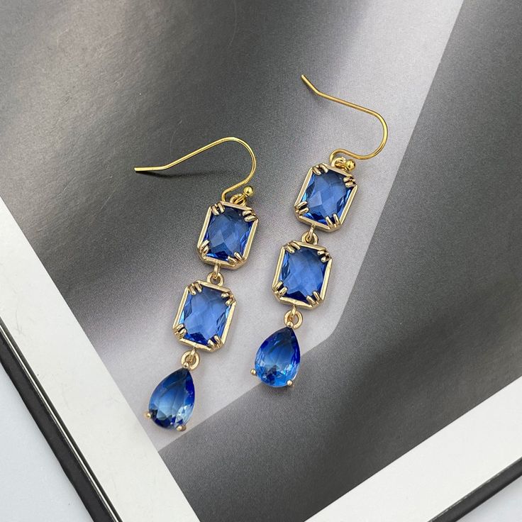 ❤️Deliver gifts on time with our recommended ship-by dates.❤️ - 16 DEC USPS first class mail - 18 DEC USPS Priority mail - 20 DEC USPS Priority mail express Evoke the serene beauty of Mediterranean shores with these Capri Blue Crystal Earrings. Their luminous blue hue captures the essence of sunlit waters, while the shimmering facets reflect light in a dance of brilliance. Perfect for elevating any ensemble, these earrings bring a touch of coastal elegance and timeless sparkle to your jewelry co Elegant Blue Hypoallergenic Teardrop Earrings, Blue Dangle Teardrop Earrings For Pierced Ears, Blue Teardrop Dangle Earrings, Blue Drop Crystal Earrings For Party, Blue Teardrop Crystal Earrings For Pierced Ears, Blue Long Drop Teardrop Earrings, Single Blue Teardrop Earring, Blue Long Drop Teardrop Earrings For Pierced Ears, Blue Long Drop Teardrop Earrings Gift