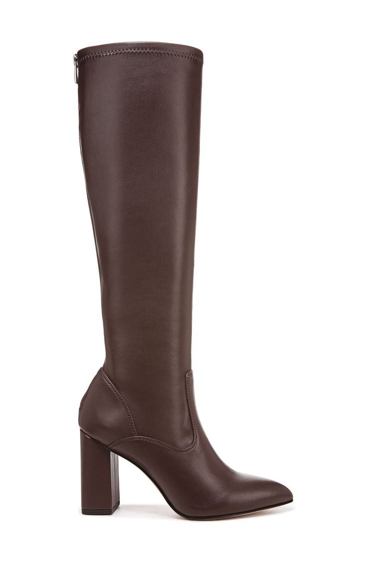 Classic and versatile, this boot is sure to be a fave thanks to a back zipper for easy on-and-off styling along with a pointed toe that gives you legs for days. 3 1/2" heel 15 1/4" shaft; 12 3/4" calf circumference Synthetic upper and lining/rubber sole Imported Formal Boots With Zipper Closure And Block Heel, Faux Leather Heeled Boots With Sculpted Heel For Work, Elegant Boots With Zipper Closure In Medium Width, Elegant Boots With Zipper Closure, Medium Width, Formal Heeled Boots With Zipper Closure, Heeled Boots With Zipper Closure For Workwear, Workwear Boots With Zipper Closure And Block Heel, Faux Leather Heeled Boots With Almond Toe For Work, Faux Leather Almond Toe Heeled Boots For Work