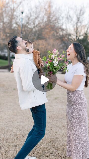 a man is giving flowers to a woman