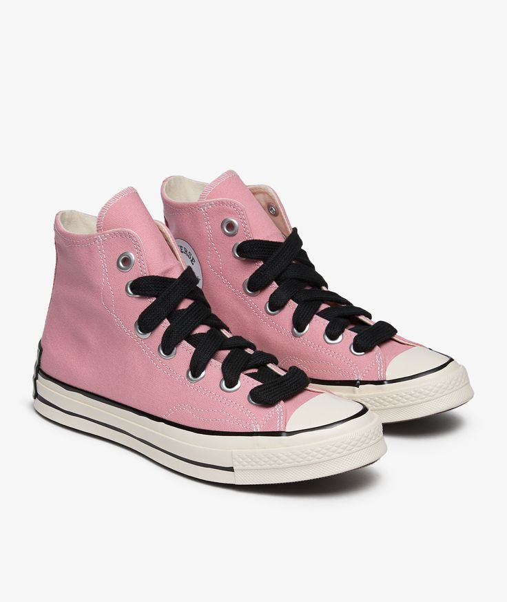 Converse, a brand with a rich history dating back to the early 20th century, continues to captivate sneaker enthusiasts with its timeless designs and innovative approach to footwear. Introducing the Chuck 70 HI Sketch in Rosa for Fall/Winter 2024, a classic and retro-inspired silhouette that pays homage to the iconic Converse Chuck Taylor All Star model. Known for its versatility and comfort, the Chuck 70 HI Sketch is the perfect addition to your sneaker collection. Elevate your style with a touch of elegance and flair. Get your hands on these stylish kicks now at SVD. Vintage Lace-up Sneakers With Rubber Toe Cap, Converse Retro Sneakers With Contrast Sole, Retro Converse Sneakers With Contrast Sole, Vintage Converse Sneakers With Rubber Sole, Classic High-top Sneakers With Laces, Retro Converse High-top Sneakers With Laces, Retro Pink Sneakers With Laces, Retro Pink Sneakers, Vintage Converse Sneakers With Rubber Toe Cap