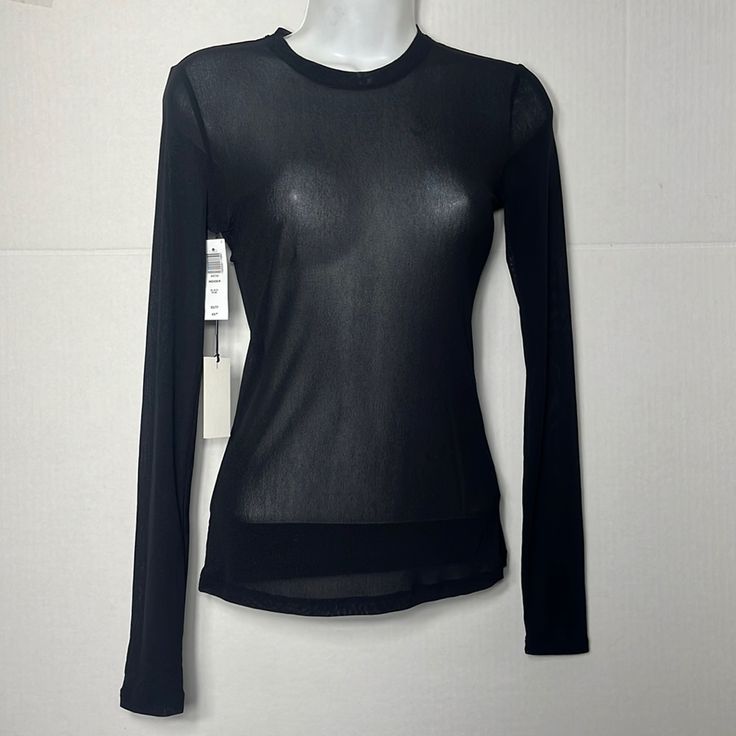 This Is A Crewneck Longsleeve A Size Xs Will Fit Someone Who Typically Wears A 0 In Other Aritzia Clothing. Depending On Body Shape And Fit Preference, A Xs May Also Fit Someone Who Wears A 00 Or 2. Bust 32 In 33 In Waist 24 In 25 In Spring Solid Tops With Sheer Sleeves, Casual Blouse With Mesh Sleeves, Casual Fitted Blouse With Mesh Sleeves, Stretch Crew Neck Mesh Top For Layering, Stretch Mesh Top With Crew Neck For Layering, Fitted Crew Neck Blouse For Layering, Stretch Crew Neck Blouse For Night Out, Casual Fitted Top With Sheer Sleeves, Fitted Solid Sheer Tops