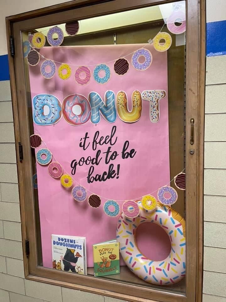 a bulletin board with doughnuts and donuts on it in a classroom window