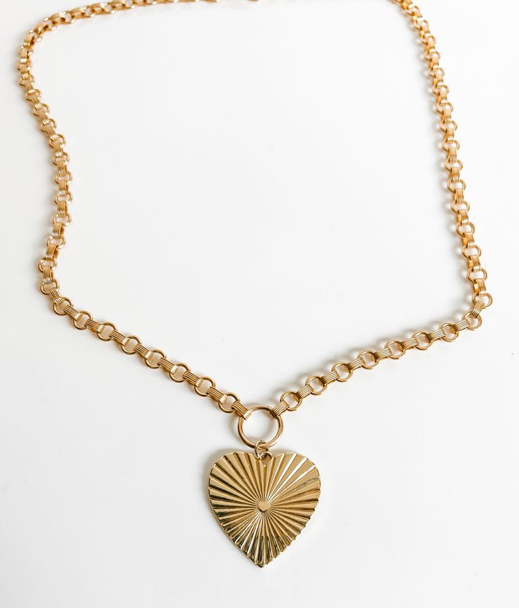 This beautiful chunky rolo chain is a classic. with a beautiful 1.5 inch Lulu heart charm All components 14k gold filled. 14k Gold-filled Heart Necklace With Heart Charm, Heart-shaped Gold-tone Charm Necklace With Adjustable Chain, Gold-tone Heart Pendant Necklace With Lobster Clasp, Gold Plated Heart Necklace With Charms, Gold-tone Heart Pendant Chain Necklace Tarnish Resistant, Everyday Gold-tone Heart Charm Necklace, 14k Gold-filled Heart Necklace With Adjustable Chain, Gold-tone Heart Pendant Chain Necklace, Gold Heart Necklace With Chunky Chain