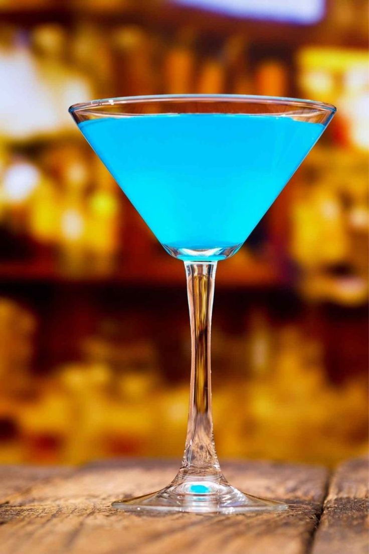 a blue drink sitting on top of a wooden table