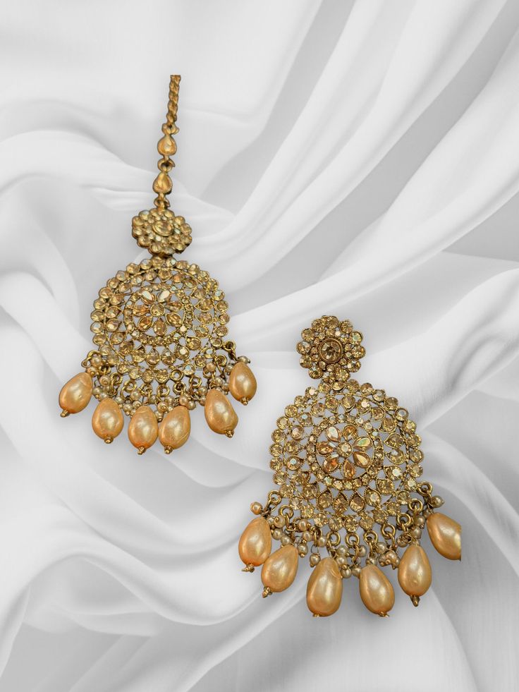 These chandbalis with matching maangtikka comes as a pair and is beautifully handmade with high quality polki stones. This set is perfect for any bridesmaid, bride, sangeet or any occasion or event as a gift for any occasion as any one who loves jewelry will love this statement piece. It has beautiful colors that really make the set a statement piece. Product Details: • Tikka • Earrings Free Shipping/Ready to Ship and available immediately if you place an order today! Fast and Free Shipping US C Bollywood Style Sets With Stone Work For Wedding, Diwali Lehenga With Stone Work, Gold Anarkali Set With Tilla Embroidery, Kundan Bridal Earrings With Gota Work For Wedding, Wedding Kundan Bridal Earrings With Gota Work, Festive Kundan Bridal Sets In Chandbali Shape, Diwali Kundan Chandbali Sets, Festive Chandbali Bridal Sets For Eid, Festive Chandbali Bridal Set For Diwali