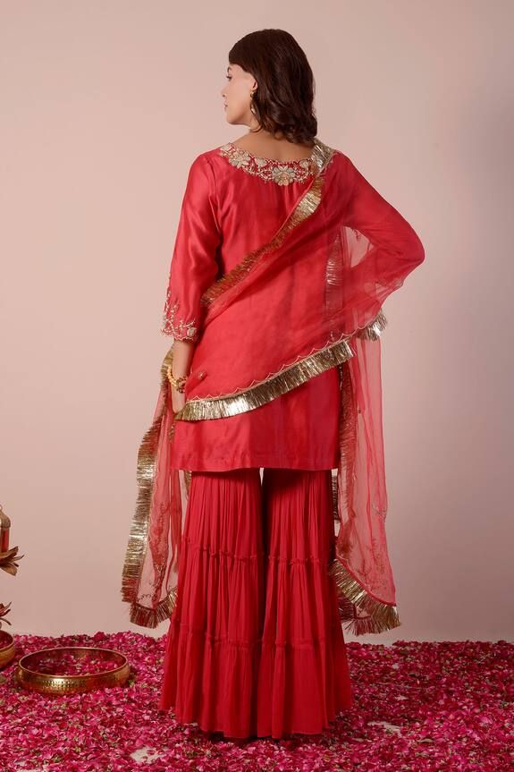 Apple red kurta with sequin, bead, cutdana embroidery in floral placement pattern. Paired with tiered gharara and dupatta. - Aza Fashions Red Lehenga With Dabka Work For Celebration, Red Salwar Kameez With Gota Work For Celebration, Red Anarkali Set With Gota Work For Celebration, Red Palazzo Set With Gota Work And Traditional Drape, Red Chinon Palazzo Set With Dori Work, Red Palazzo Set With Dori Work For Festivals, Red Palazzo Set With Gota Work, Red Dori Work Sharara For Diwali, Festive Red Sharara With Dori Work