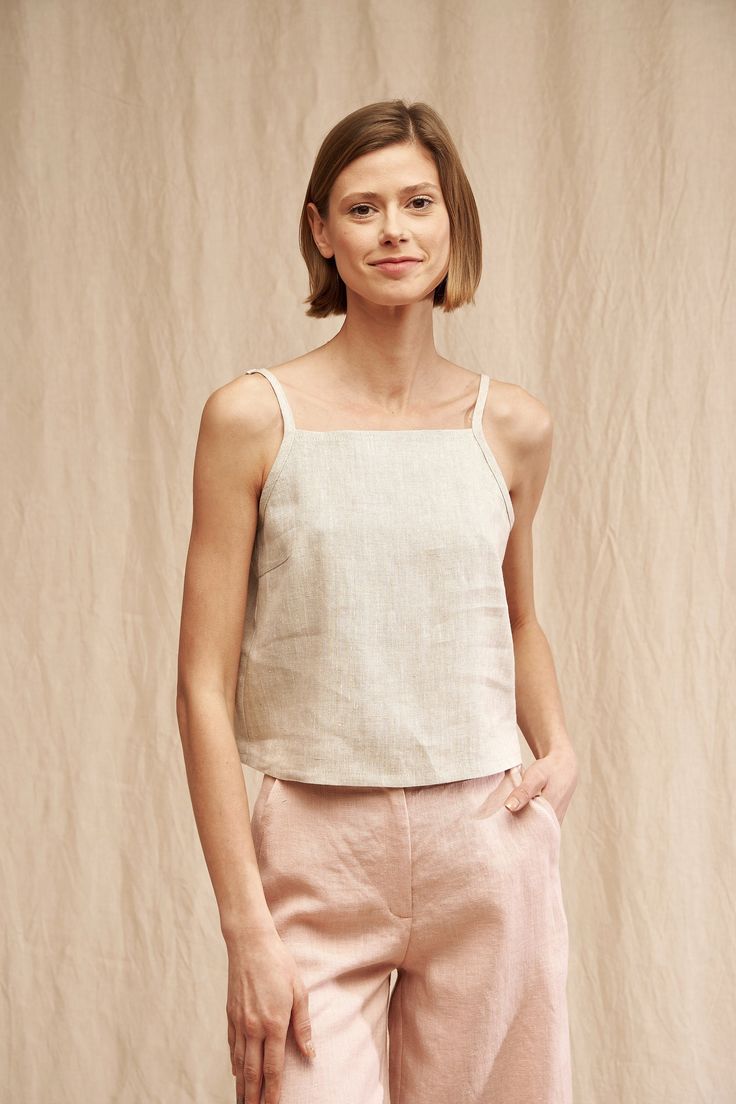 "Bring charm to your everyday outfits with our SKYLAR top. FABRIC: 100% Washed Lithuanian Linen COLOR: Please choose the desired color from the side menu. STYLE: Linen crop top with spaghetti straps. SIZE CHART (body measurements): 2 US/ 6 AU/ 34 EU: Bust 31.5\" (80 cm) , Waist 23\" (59 cm), Hips 35\" (88 cm) 4 US/ 8 AU/ 36 EU: Bust 33\" (84 cm) , Waist 25\" (63,5 cm), Hips 36\" (92 cm) 6 US/ 10 AU/ 38 EU: Bust 35\" (88 cm) , Waist 26,5\" (67,5 cm), Hips 38\" (96 cm) 8 US/ 12 AU/ 40 EU: Bust 36\ Linen Spaghetti Strap Top, Casual Summer Tops With Straps, Casual Summer Camisole With Tie Straps, Beige Crop Top With Built-in Bra For Summer, Chic Linen Camisole For Day Out, Summer Camisole Tops With Tie Straps, Linen Camisole For Day Out, Chic Linen Tank Top With Adjustable Straps, Spring Relaxed Fit Crop Top Tank Top