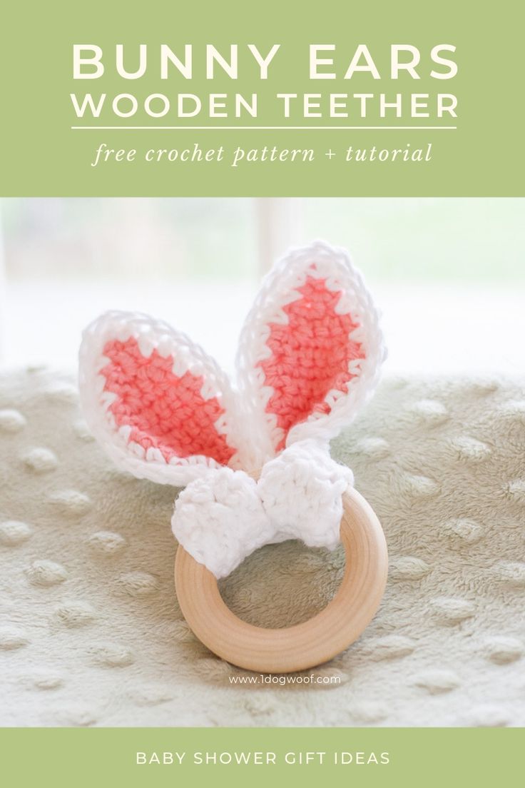 a crocheted bunny ear is on top of a wooden ring with text overlay that says, free crochet pattern and video baby shower gift ideas