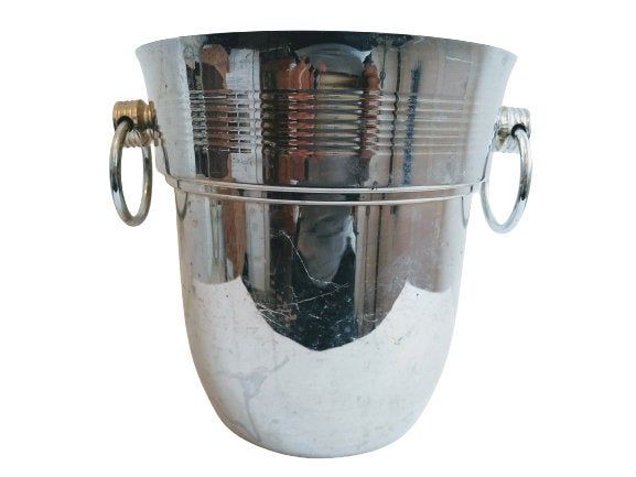 a large metal bucket filled with lots of assorted items