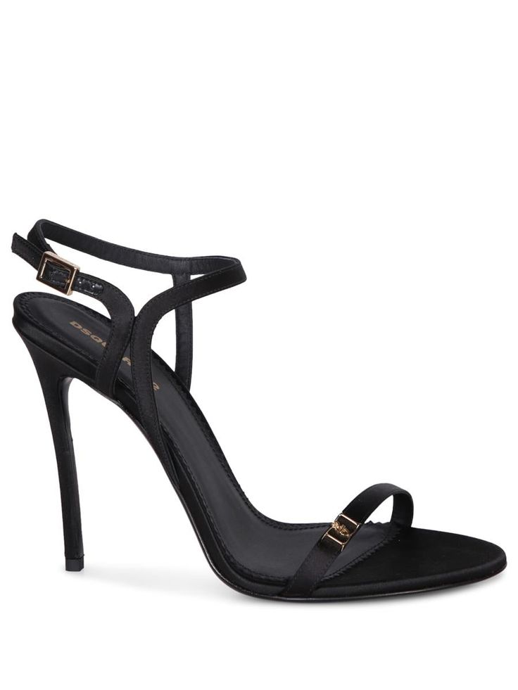 High stiletto heel sandals with crisscross straps and decorative golden buckle.. Express elegance and sophistication with Dsquared2's Double D Black Mules. This enticing model features a sleek silhouette with golden buckle details adding a touch of luxury.Gender: WomenMaterial: 100% SATIN 100% CALF LEATHERColor: BlackMade in: ImportedProduct ID: HSW0250 00100001 2124*Import tax/duty will be calculated at checkout (If applicable) Chic Open Toe Heels With Metal Pin Buckle, Elegant Sandals With Gold Buckle For Summer, Elegant Summer Sandals With Gold Buckle, Chic Formal Sandals With Gold Buckle, Elegant Open Toe Sandals With Gold Buckle, Luxury Heels With Gold Buckle, Designer Party Heels With Gold-tone Hardware, Elegant Open Toe Heels With Gold Buckle, High Heel Sandals With Gold-tone Hardware For Parties