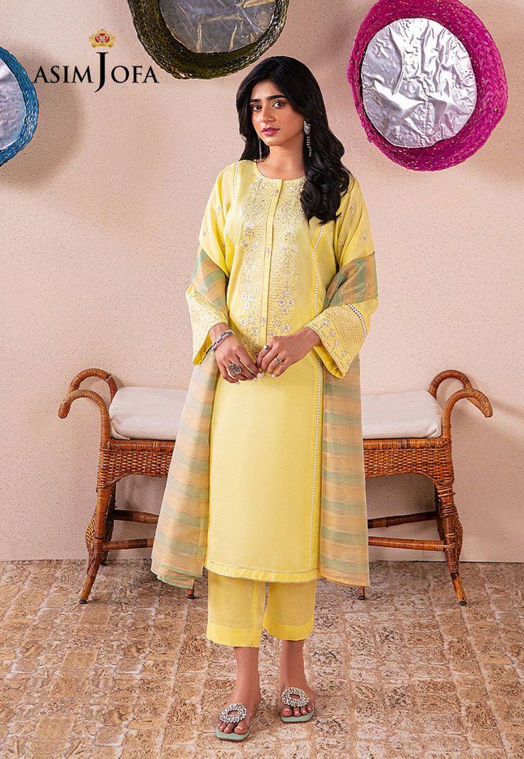 Shirt: Indian raw silk By Pcs: 3 Pcs Trouser: Indian raw silk Dupatta: Organza Color: Yellow Fabric composition: Blended Product Details Bask in this lime yellow ethnic embroidered piece- a lavish trio that exudes opulence and traditional elegance. Semi-stitched Raw Silk Dresses, Traditional Silk Drape Dresses For Eid, Traditional Drape Silk Dresses For Eid, Silk Dresses With Traditional Drape For Eid, Bollywood Silk Dresses For Eid, Raw Silk Dresses With Dupatta, Silk Kurta With Dabka Work For Eid, Silk Straight Kurta With Dabka Details, Straight Kurta Dress With Resham Embroidery In Raw Silk