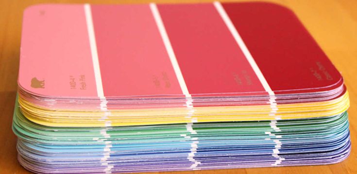 many colors of paper stacked on top of each other