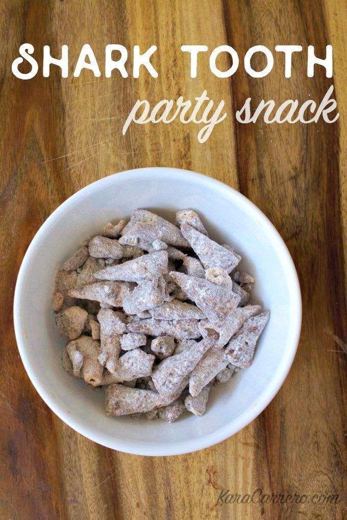 a white bowl filled with dog treats on top of a wooden table