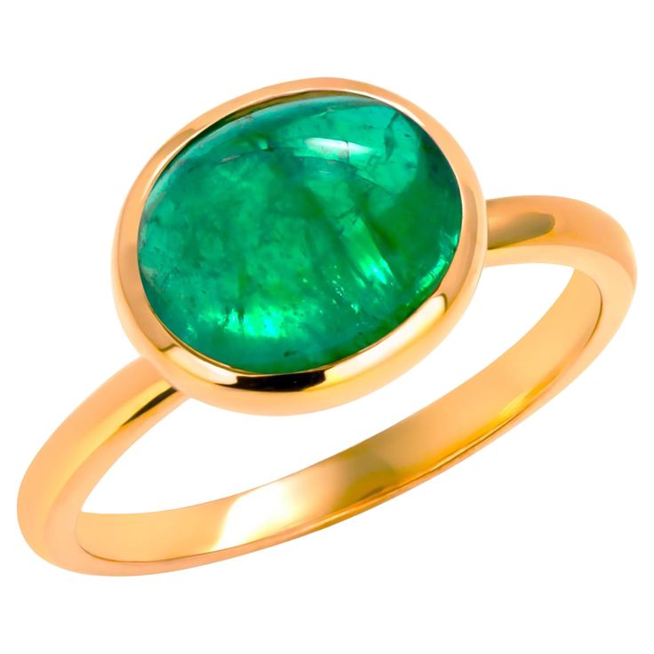 Exquisite Cabochon Emerald 2.50 Carat Solitaire Ring in 14 Karat Yellow Gold - Size 6 Elevate your style with our stunning Cabochon Emerald Solitaire Ring, a mesmerizing piece that effortlessly combines timeless elegance with modern sophistication. The star of the show is a brilliant 2.50 carat cabochon-cut emerald, exuding a captivating aura with its deep green hue and smooth, polished surface. Gemstone Excellence: The 2.50 carat cabochon emerald takes center stage, its rounded shape showcasing the gem's natural beauty. The cabochon cut enhances the emerald's color and allows for a play of light that mesmerizes with every movement. Craftsmanship in 14 karat Yellow Gold: The emerald is securely cradled in a lustrous yellow gold bezel setting, adding a warm and luxurious touch to the piece. Emerald Solitaire Ring, Bezel Set Ring, Emerald Color, Set Ring, Center Stage, Belleza Natural, Deep Green, Bezel Setting, Solitaire Ring