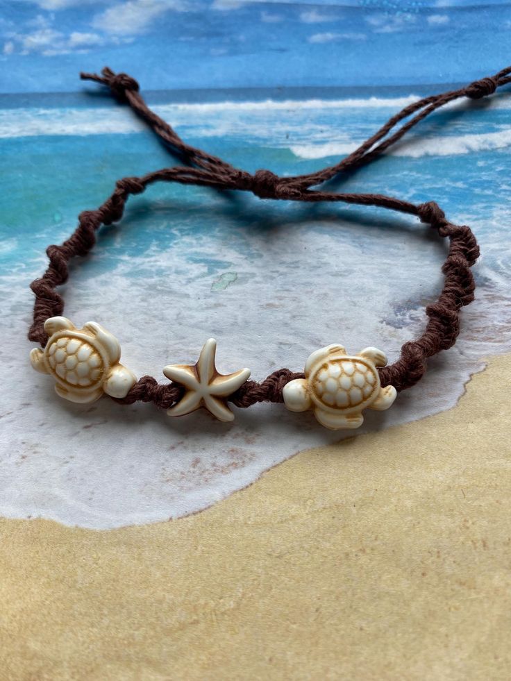 Pair of turquoise polymer sea turtles and a starfish adorn this boho style of sliding, knotted cord 'friendship bracelet' or anklet. Diameter of opening is 12.5 ", easily slides over womens size 8.5-9 shoe for anklet. (Matching earring sold separately, https://www.etsy.com/listing/607942985/surf-buddy-earrings-turquoise-sea-turtle) Background Pics, Tropical Jewelry, Turtle Bracelet, Friendship Bracelets Designs, Bead Projects, San Juan Capistrano, Bone Color, Earrings Turquoise, Sea Turtles