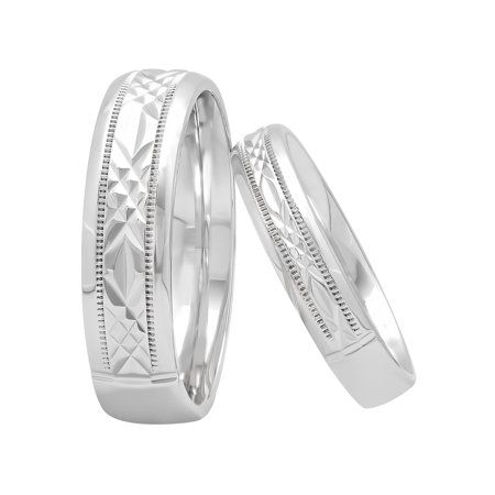 two white gold wedding bands with intricate engraving on each side, set in 18k white gold