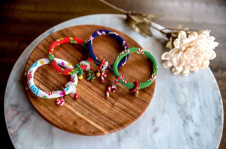 These beautiful beaded bracelets are perfect for celebrating the winter in style! These festive bracelets are available in 4 different colors: Dark Blue, Red, Green, and White. Our seed beads are of the highest quality and add a beautiful sparkle to our bracelets. These festive bracelets make great gifts for friends and family. They're a unique and thoughtful gift that will be sure to please. These bracelets are also perfect for all occasions! 🪡 PRODUCT DETAILS: * Standard size that fits all * Multicolor Beaded Bracelets For Holiday, Festive Holiday Jewelry With Colorful Beads, Holiday Festive Jewelry With Colorful Beads, Handmade Multicolor Beaded Bracelets For Holidays, Colorful Beaded Jewelry For Holiday Gifts, Adjustable Beaded Bracelets For Party And Holiday, Adjustable Beaded Bracelets For Holiday Party, Holiday Jewelry Gift With Colorful Beads, Holiday Gift Jewelry With Colorful Beads