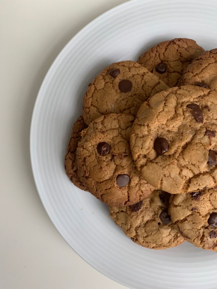 chocolate chip cookies in a white bowl on a table