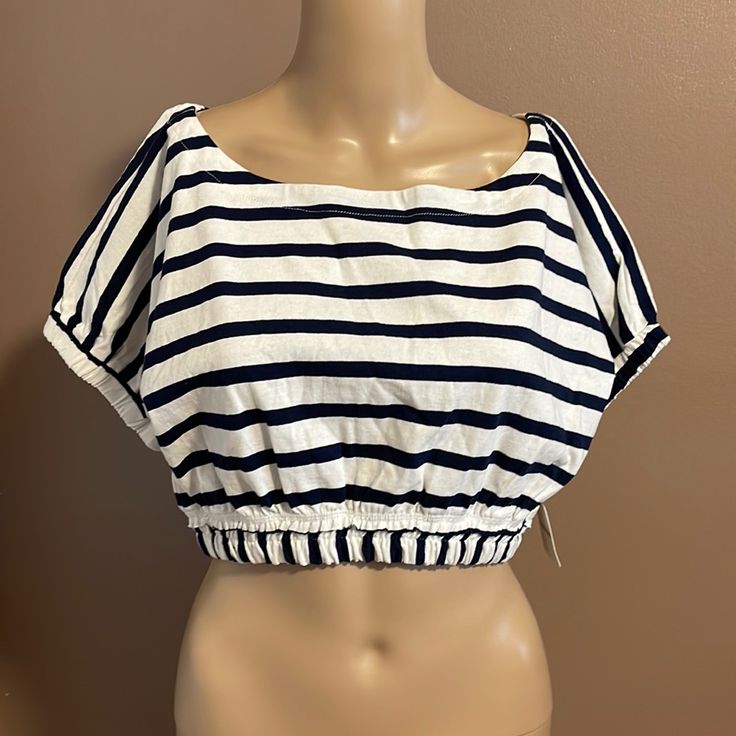 Free People Beach Navy Shite Striped Crop Top Elastic Hem Short Sleeve Size Xs 17 Inch Across Armpit 15 Inch Length. Shoulder To Hem 100% Cotton Machine Wash Cold Casual Striped Beach Blouse, Chic Striped Top For Vacation, Striped Cotton Blouse For Vacation, Casual Striped Tops For Vacation, Summer Vacation Striped Blouse, Striped Summer Tops For The Beach, Summer Striped Tops For Beach, Summer Striped Tops For The Beach, Beachy Cotton Tops For Day Out