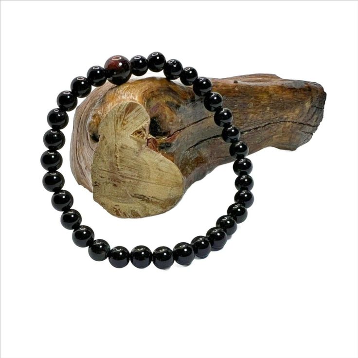 Black Onyx Stretch Bracelet with 6mm beads and 1 8mm Mahogany bead. The beads are powerful stone and gives strength and energy. They are grade AAA beads. Black Onyx Bracelet, Bracelet Men, Onyx Bracelet, Onyx Gemstone, Gemstone Beaded Bracelets, Beads Bracelet, Gemstone Bracelet, Stretch Bracelet, Black Onyx