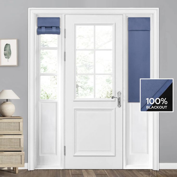 an open white door with blue blinds in front of it and a lamp on the side table