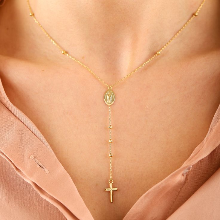 "This lovingly handcrafted 14K Solid Gold Satellite Chain Rosary Cross Necklace, Dainty Lariat Virgin Mary and Cross Dew Drops Y Necklace makes the perfect gift for mothers, Gift for sisters, Gift For Christmas, and friends. Featuring a Virgin Mary medal, and a cross pendant, this delicate looking necklace is both elegantly designed, and religiously infused. D E T A I L S * 100% 14K(585) Real Gold (no gold-filled or no gold plated material) * Chain on ball diameter: 2.60 mm * Cross Height: 1.30 Christmas And Friends, Chain Rosary, Rosary Cross, Dew Drops, Premium Gift, Necklace Dainty, Gift For Christmas, Chain Ring, Virgin Mary