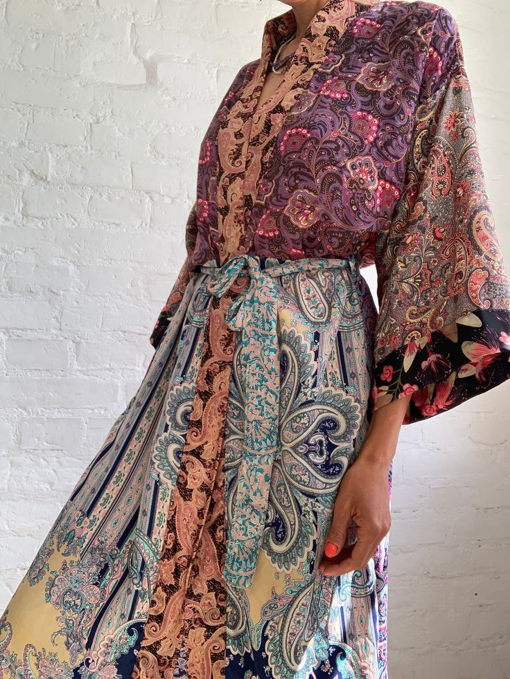 "This is free size patchwork robe, super comfy around the house and as an outside long boho style topper  Perfect on the beach, hotel or spa can also be worn on its own or layered over jeans and t shirt MEASURE made free size length 55\" MATERIAL *silk and polyester  *no lining  More boho style ideas at  https://www.etsy.com/shop/AltheaStores Thank You for looking" Multicolor Patchwork Kimono For Vacation, Multicolor Wrap Kimono For Festivals, Multicolor Long Kimono With Boho Print, Multicolor Wrap Kaftan For Beach, Long Multicolor Boho Kimono, Hippie Multicolor Open Front Kimono, Multicolor Long Kimono For Loungewear, Maxi Length Boho Print Kimono For Beach, Multicolor Free Size Boho Print Kimono