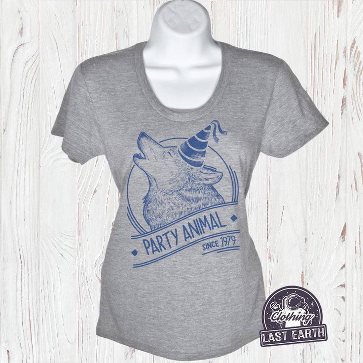 This Party Animal Wolf T-Shirt is available in 9 unique clothing styles and colors in all sizes, including men, women, and children tees, tank tops, sweatshirts, and hoodies. Each shirt graphic is professionally printed on super soft ring-spin tees with a vintage look and soft hand feel. Enter the Year you would like in the Checkout Notes. [ SIZING MEASUREMENTS ] SEE SIZE CHART Men's & Kids Tee sizes run true to size. Whatever size you normally wear should fit fine. This includes Tanks. Wome Novelty Graphic Print T-shirt For Birthday, Band Merch T-shirt With Graphic Print For Birthday, Novelty Graphic Print Birthday T-shirt, Novelty Short Sleeve Tops For Birthday, Pre-shrunk Short Sleeve T-shirt For Parties, Graphic Tee For Party, Graphic Tee With Screen Print For Birthday, Novelty Birthday T-shirt With Crew Neck, Crew Neck Shirt With Screen Print For Birthday