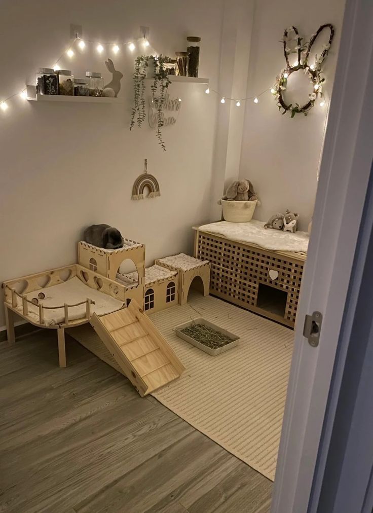 a child's room with toys and lights on the wall