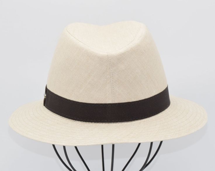 Introducing our Linen Indiana Style Hat, a timeless accessory blending classic style with modern flair. Crafted from premium linen, this hat offers lightweight comfort and breathability. Inspired by the iconic Indiana model, it features a versatile design suitable for various occasions. Whether exploring the outdoors or strolling through the city streets, this hat adds a touch of sophistication to any ensemble. Elevate your look with our Linen Indiana Style Hat, the epitome of effortless eleganc Classic Panama Hat With Upf 50+ Short Brim, Modern Everyday Summer Hat, Beige Curved Brim Panama Hat For Everyday, Classic Panama Hat For Spring, Classic Lightweight Wide Brim Panama Hat, Classic Panama Hat With Wide Brim And Lightweight Design, Classic Lightweight Adjustable Fedora, Lightweight Adjustable Classic Fedora, Elegant Lightweight Natural Color Hat