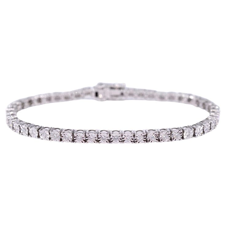 This white gold tennis bracelet with diamonds is a stunning piece of jewelry that is sure to make a statement. Featuring 1.20 carats of brilliant cut diamonds, this bracelet sparkles and shines from every angle. The diamonds have a F-G color and SI-P clarity, ensuring they are of the highest quality. The bracelet itself is made of 14 karat white gold and weighs 11.4 grams. Measuring 18cm in length, this piece is perfect for any occasion. With a retail value of €4,500, this bracelet is not only beautiful, but also a valuable investment for your jewelry collection. Diamonds Weight: 1.20 carat Cut: Brilliant Colour: F-G Clarity: SI-P Quality: Very good Jewel: Bracelet Weight: 11.4 grams Hallmark: 14 karat 585 Length: 18cm Condition: New Retail value: € 4.500,- Jewel Bracelet, Gold Tennis Bracelet, Bracelet With Diamonds, Bracelet Tennis, Les Angles, Tennis Bracelet Diamond, Tennis Bracelet, Brilliant Colors, Brilliant Cut Diamond