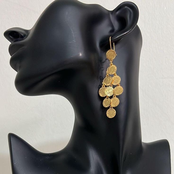 Hi there! A fine set of earrings from the Arabian heritage. 24K gold plated with coins. Wear it to your photoshoot, henna party, or as a wedding guest. Or on Eid! This piece falls under the category of gold imitation. It has the same design as real gold pieces sold in the Middle East. Enjoy it! Since this piece is gold plated, please wear it gently as its color should last you much more than any other piece of jewelry. Please avoid washing or scratching the plating away, and keep out of contact Saudi Gold Earrings Design, Gold Temple Jewelry Danglers, Gold Temple Jewelry Drop Earrings, Gold Temple Jewelry Style Drop Earrings, 22k Gold Dangle Earrings, Gold Drop Earrings In Temple Jewelry Style, Gold Round Earrings For Festive Season, Gold Round Earrings For Festive Occasions, Gold Danglers With Latkans For Celebration