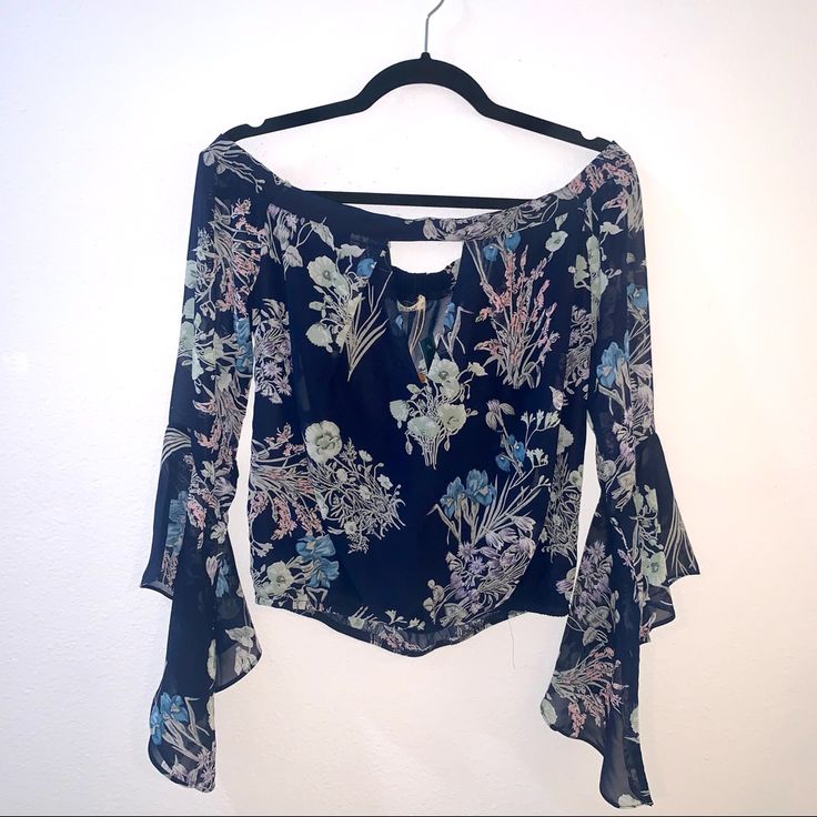 Sexy Boutique Top. Floral Print With Bell Sleeves. Off The Shoulder Style With Deep V In The Front For Perfect Cleavage. Nwt And So Cute! Off-shoulder Floral Print Party Blouse, Off-shoulder Floral Print Party Tops, Fitted Off-shoulder Floral Print Top, Elegant Off-shoulder Floral Print Tops, Flowy Long Sleeve Tops For Night Out, Off-shoulder Blouse For Date Night In Spring, Blue Off-shoulder Top With Floral Print, Floral Print Crop Top For Party, Blue Off-shoulder Floral Print Tops