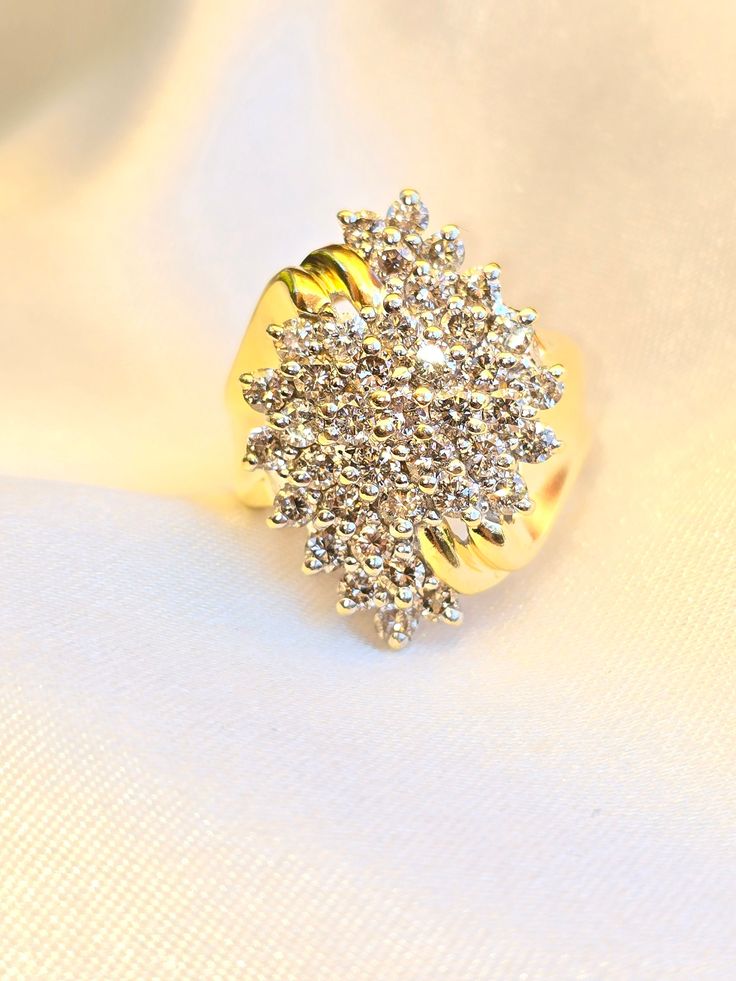 Thick and sparkly vintage gold ring.  Clustered round natural diamonds across the front forming a marquise like shape. approximately 1.5 TCW, imperfect diamonds with visible inclusions. Very gorgeous cocktail/ statement ring made from 14k solid yellow gold face of the ring is 23mm tall x 16mm wide Size US 7, sizable 2 +/- sizes weighs 7.4 grams Ships free out of Southern California Please expect signature delivery Classic Gold Sparkling Rings, Dazzling Marquise-cut Cluster Ring With Single Cut Diamonds, Dazzling Marquise Cut Cluster Ring With Single Cut Diamonds, Dazzling Marquise Cut Diamond Ring With Single Cut Diamonds, Marquise Cluster Ring With Diamond Accents In Cubic Zirconia, Sparkling Diamond Rings In Yellow Gold, Diamond Rings In Yellow Gold With Sparkling Details, Yellow Gold Diamond Rings With Sparkling Details, Gold Cluster Diamond Ring With Brilliant Cut