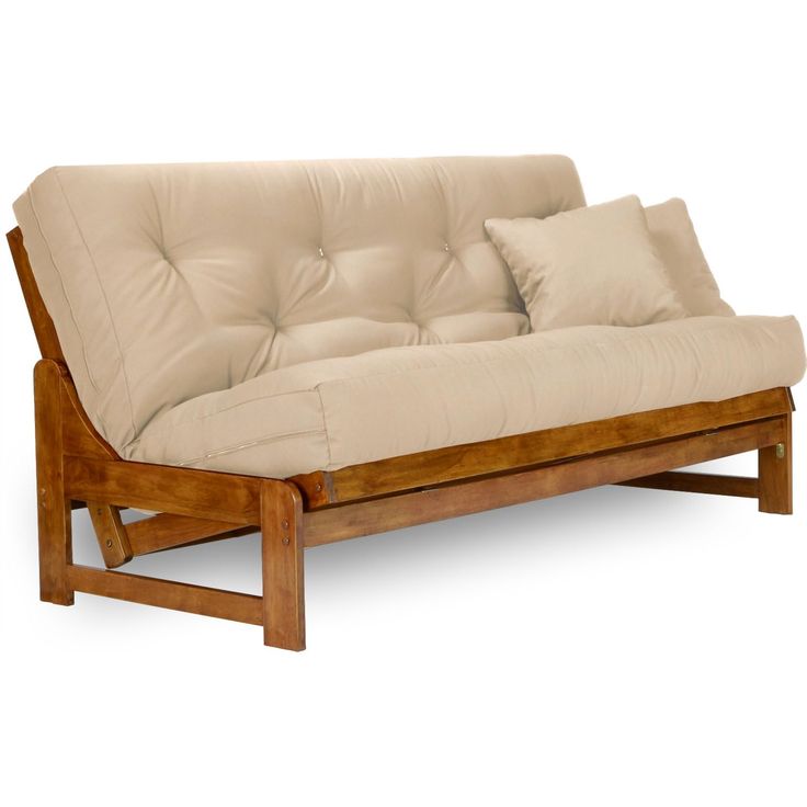 a futon sofa with two pillows on it's back and one arm extended