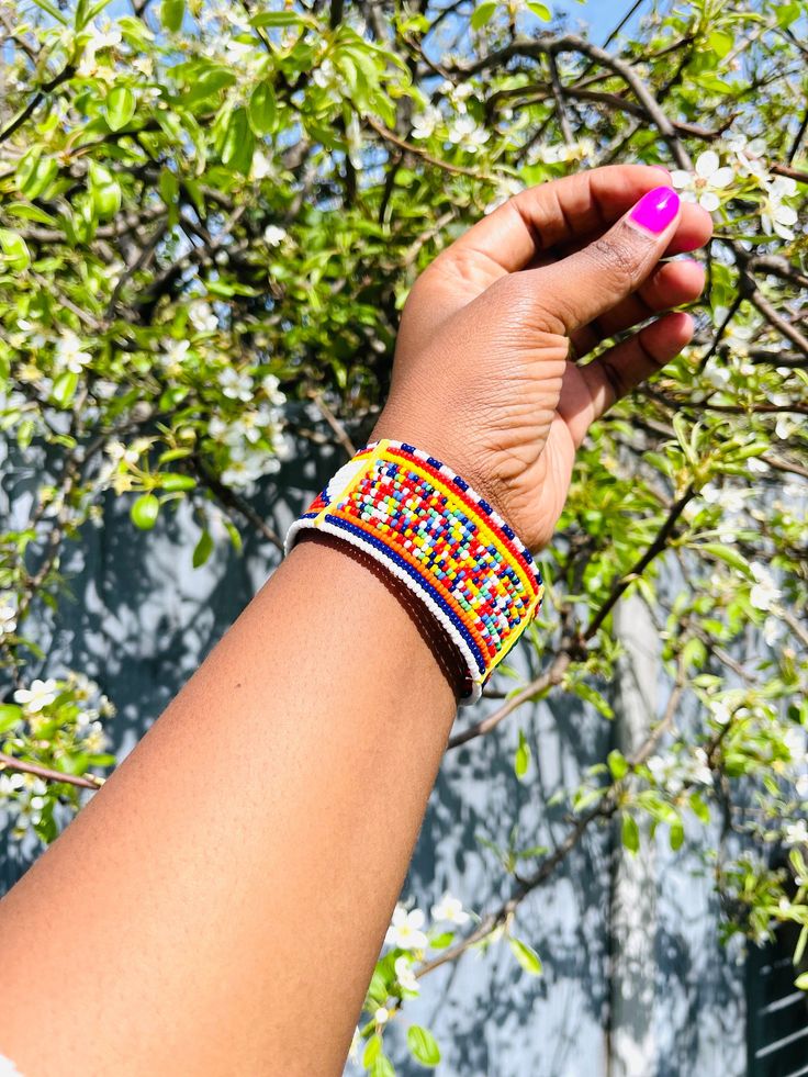 Handmade Africa beaded multi Unisex bracelet bangle.  This lovely bangle are made from glass beads.  Do not stretch or adjustable. Made in Kenya by the Masai Tribe. Unique gift. NOTE; THE BANGLE MEASUREMENTS ARE TAKEN WHILE THE BANGLE IS NOT FASTENED. All BRACELET MEASURING 8 INCHES LONG X 1.2 INCHES WIDE. Colourful Bangles, Masai Jewelry, Masai Tribe, Africa Kenya, Colorful Bangles, Bead Bangles, Maasai, Unisex Bracelets, Bracelet Bangle