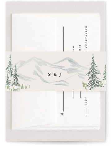 two envelopes with trees and mountains on them