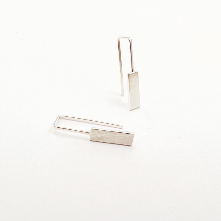 These edgy earrings are made of sterling silver. Perfect for your casual outfit and great as a stylish gift for those who like simple minimalist look. Inspired by simple geometrical forms. The length is 20mm= 025⁄32in and the thickness of the wire is approximately 0.8mm= 01⁄32in. If you would like another length or rectangular size, please write me!  This listing is for one pair (2 earrings). Custom orders are welcomed and every listed item can be adjusted to your wishes!  Every item is carefull Minimalist Silver Rectangular Earrings, Modern Silver Earrings With Rectangular Pendant, Modern Silver Rectangular Pendant Earrings, Everyday Modern Rectangular Linear Earrings, Sterling Silver Rectangular Everyday Earrings, Everyday Sterling Silver Rectangular Earrings, Nickel-free Square Minimalist Earrings, Minimalist Square Nickel-free Earrings, Minimalist Sterling Silver Linear Earrings