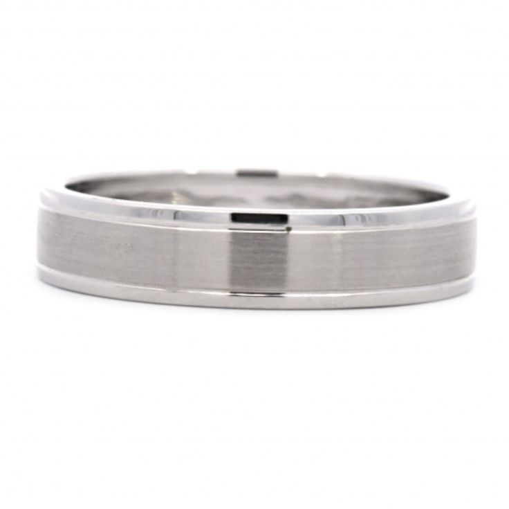 a white gold wedding ring on a white background