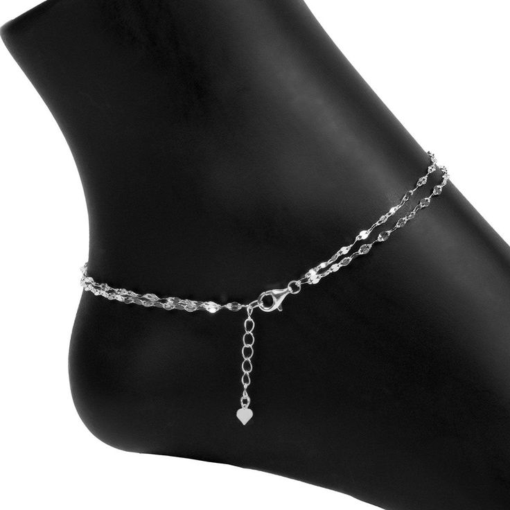 Our Italian-made Specchio Mirror Chain Anklet is a fun, flirty, and fashionable addition to your anklet collection! The Double Strand Specchio Mirror Chain Anklet is sure to be your new "go-to" accessory for fun in the sun or an elegant evening out. Options: Also Available in Gold SEE ALL ANKLETS PRODUCT DETAILS Size: 9"+1" extension, including clasp Closure: Lobster Clasp Metal: .925 Sterling Silver Finish: Rhodium (prevents tarnishing) Elegant Anklets With Extender, Gift Anklets With Extender, Elegant Metal Anklet With Adjustable Chain, Elegant Adjustable Chain Anklets, Silver Chain Bracelet With Extender, Metal Chain Anklets For Party, Silver Anklets With Adjustable Chain For Parties, Silver Adjustable Chain Anklets For Party, Adjustable Chain Anklet For Parties