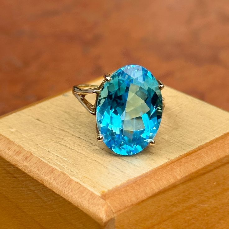 Estate/ vintage 10KT yellow gold oval-cut, genuine, blue topaz ring. Stunning blue color! Blue Topaz is the birthstone for December babies- and this piece makes a spectacular gift! Size 7.5 Can be resized for an additional fee Weight: 5.8 grams Topaz measures: 18mm x 13mm Genuine, oval-cut, checkerboard, faceted blue topaz Stamped 10KT Excellent estate condition Oval Turquoise Topaz Ring With Accent Stones, Elegant Oval Turquoise Topaz Ring With Accent Stones, Oval Blue Topaz Ring With Accent Stones, Oval Topaz Ring With Accent Stones As Gift, Formal Oval Blue Topaz Birthstone Ring, Oval Blue Birthstone Ring, Oval Blue Topaz Ring In Fine Jewelry Style, Fine Jewelry Oval Blue Topaz Ring, Oval Blue Topaz Ring Fine Jewelry